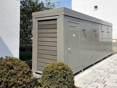 Paketbox mit Mülltonnen-Reihenanlage